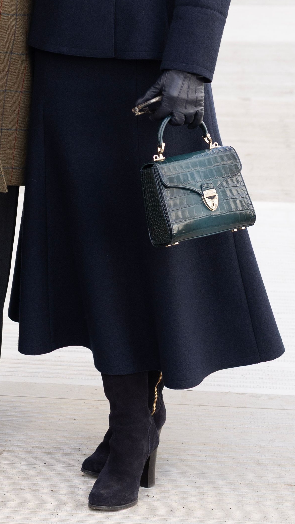 A close-up picture of Zara Tindall's bag and boots on Day 1 of Cheltenham 2026