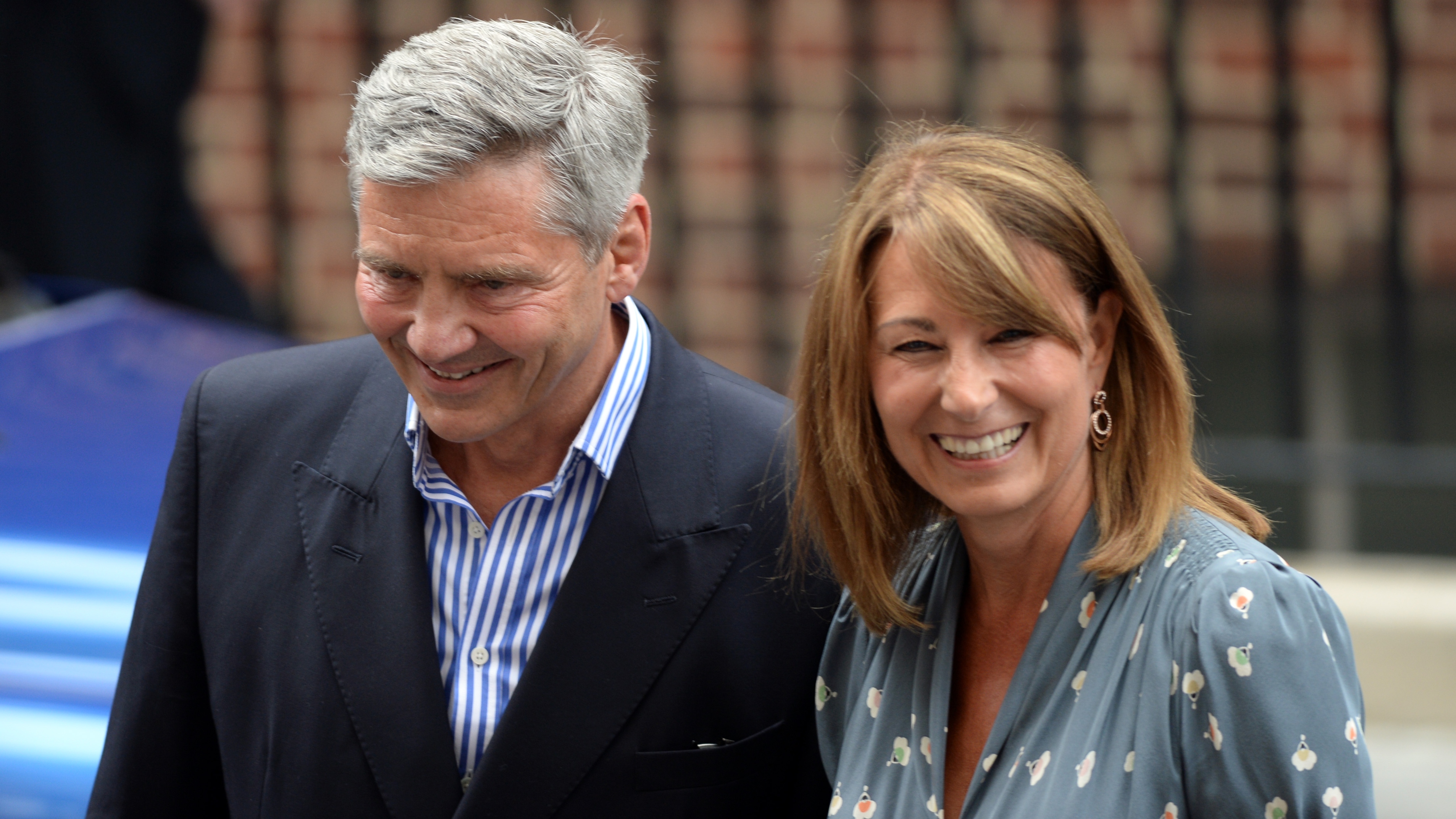 Michael Middleton and Carole Middleton depart after visiting Prince William and Kate and their newborn baby son at the Lindo Wing, St Mary's Hospital on July 23, 2013